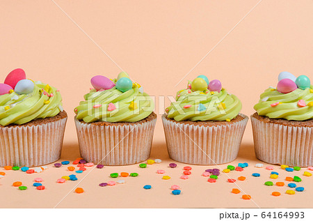 Easter pistachio cupcakes with decorations 64164993
