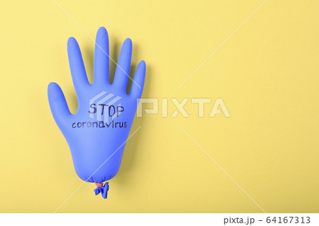 Protective blue rubber glove with STOP CORONAVIRUS 64167313