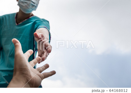 Hands of people in medical gloves reaching out for hope COVID-19 concept. 64168012