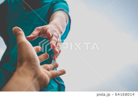 Help Concept hands reaching out to help each other. 64168014