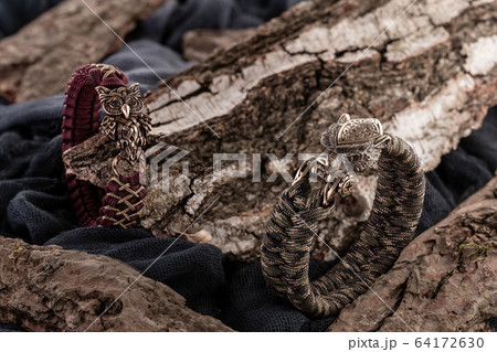 Moscow, Russia - 08/21/2019: Decoration, bracelet for men and women from the paracord on the braided bracelet made of cord Moscow, Russia - 08/21/2019: Decoration, bracelet for men and women from the paracord on the braided bracelet made of cord 64172630