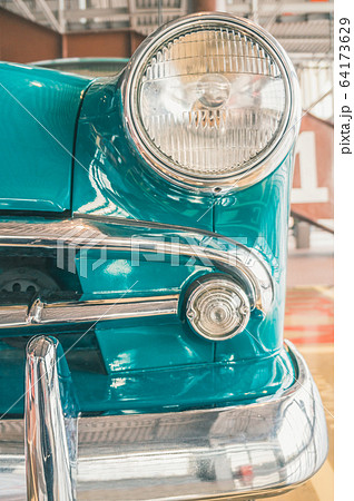 Details of retro vintage car with round headlamp 64173629