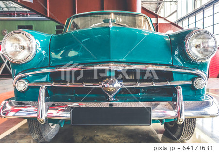 Blue and white shiny retro vintage car front view Blue and white shiny retro vintage car front view 64173631