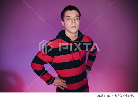 Young Man in a Jumper Dancing Contemporary Dance in Studio. Breakdancing. Dance School Poster. Copy Space. Battle competition announcement. Pink and Blue Background. Young Man in a Jumper Dancing Contemporary Dance in Studio. Breakdancing. Dance School Poster. Copy Space. Battle competition announcement. Pink and Blue Background. 64174846