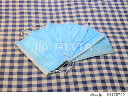 blue face masks used against corona covid-19 blue face masks used against corona covid-19 64176709