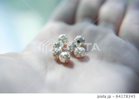 silver beads with crystals on the hand silver beads with crystals on the hand 64178345
