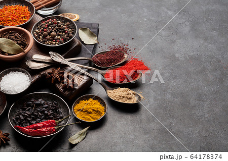 Various spices in bowls and spoons Various spices in bowls and spoons 64178374