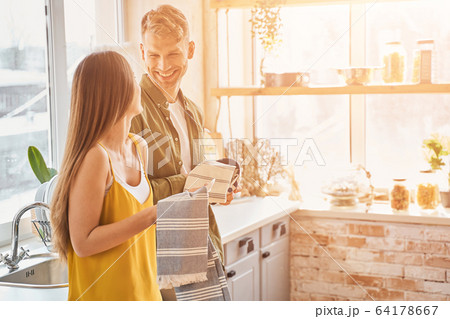 Delighted young people looking at each other 64178667