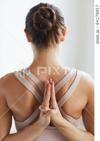 Flexible woman meditating Flexible woman meditating 64179957