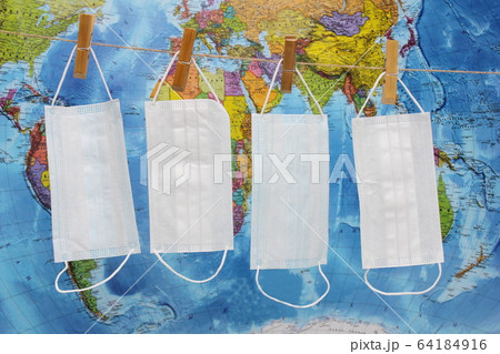 Medical masks hang on a rope on clothespins Medical masks hang on a rope on clothespins 64184916