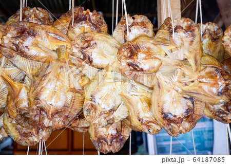 Dried fish hang on wooden to sun dry for food in Dried fish hang on wooden to sun dry for food in 64187085