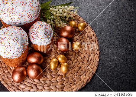 Easter eggs gold and bronze and Easter cake Easter eggs gold and bronze and Easter cake 64193959