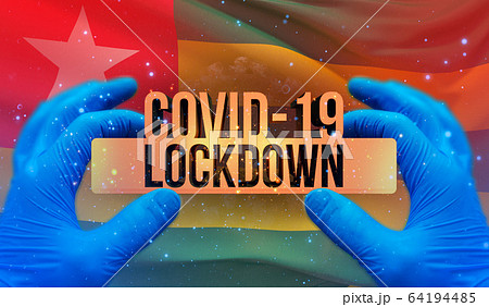 COVID-19 lockdown concept with backgroung of waving national flag of Togo. Pandemic 3D illustration. 64194485