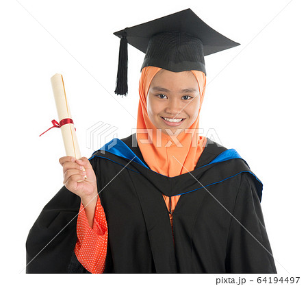 Female student in graduation gown Female student in graduation gown 64194497