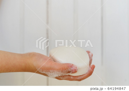 Close-up of girls (6-7) hand holding soap Close-up of girls (6-7) hand holding soap 64194847