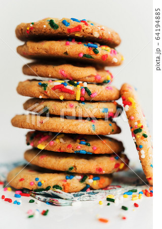 Pile of homemade cookies with colorful sprinkle Pile of homemade cookies with colorful sprinkle 64194885