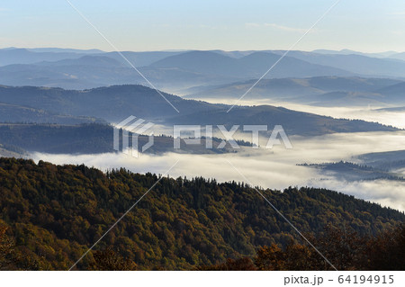 Ukraine, Zakarpattia region, Carpathians, Borzhava, Foggy hills of Carpathian Mountains at sunrise Ukraine, Zakarpattia region, Carpathians, Borzhava, Foggy hills of Carpathian Mountains at sunrise 64194915