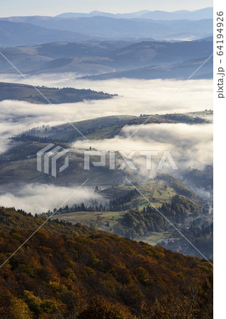 Ukraine, Zakarpattia region, Carpathians, Borzhava, Foggy hills of Carpathian Mountains at sunrise Ukraine, Zakarpattia region, Carpathians, Borzhava, Foggy hills of Carpathian Mountains at sunrise 64194926