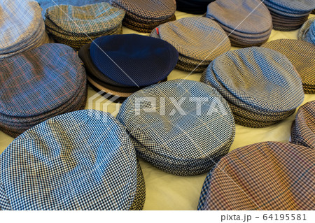 Cloth caps on sale in the Mercado Municipal - the main market in Tavira, Algarve, Portugal 64195581