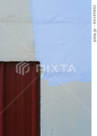 Warehouse doorway and paint covering graffiti on wall Warehouse doorway and paint covering graffiti on wall 64195602