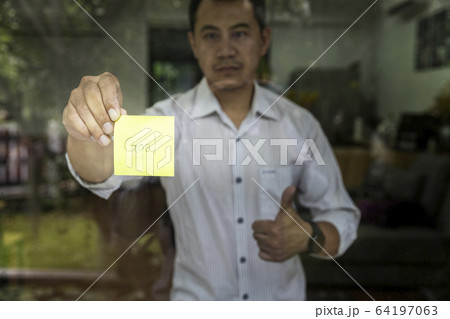 Motivation Concept. Businessman holding sticky note. Motivation Concept. Businessman holding sticky note. 64197063