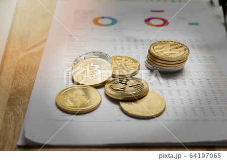 Stack of Various golden and silver of Cryptocurrency on chart or graph paper. Stack of Various golden and silver of Cryptocurrency on chart or graph paper. 64197065
