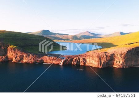 Sorvagsvatn lake on cliffs of Vagar island in sunset, Faroe Islands 64197551