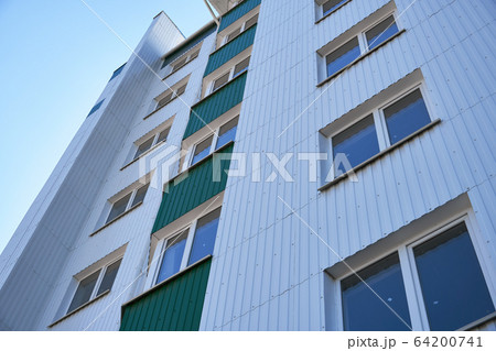facade of a new multi-storey building with white facade of a new multi-storey building with white 64200741