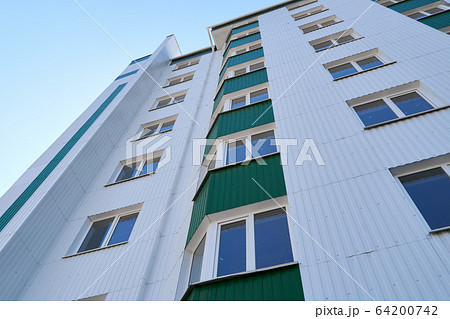 facade of a new multi-storey building with white 64200742