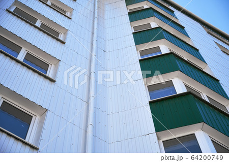 facade of a new multi-storey building with white facade of a new multi-storey building with white 64200749