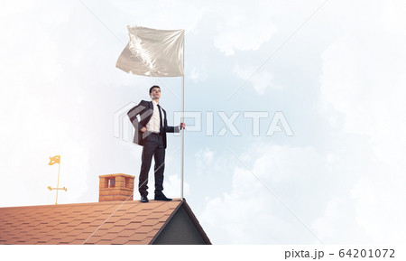 Young businessman with flag presenting concept of leadership. Mi Young businessman with flag presenting concept of leadership. Mi 64201072