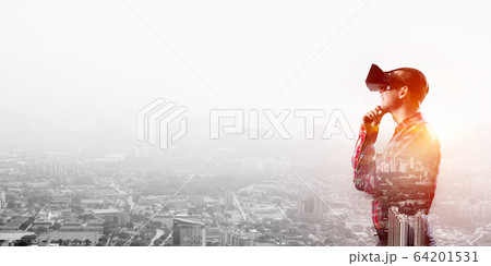 Guy wearing checked shirt and virtual mask holding hand on chin Guy wearing checked shirt and virtual mask holding hand on chin 64201531