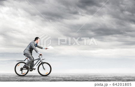 Businessman with paper documents in hand Businessman with paper documents in hand 64201805