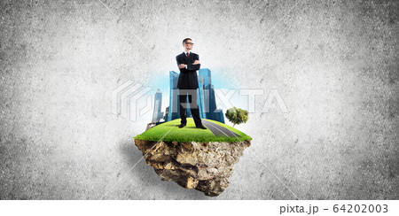 Confident boss and modern city as concept of eco green construction 64202003