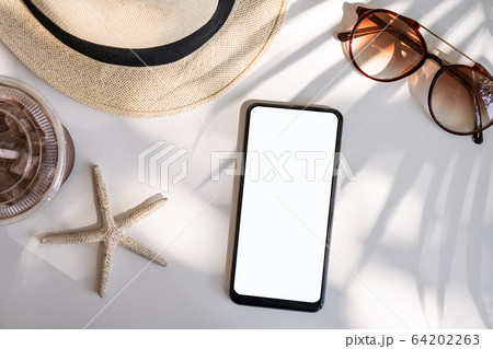 Empty screen smart phone with travel accessories 64202263