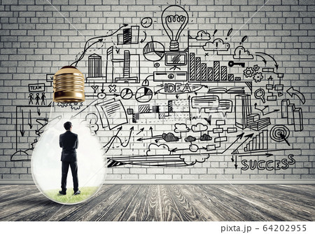 Businessman trapped in bulb Businessman trapped in bulb 64202955