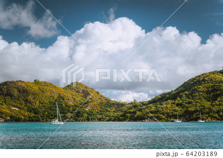 Yacht boats near an uninhabitable island near Victoria city, Mahe, Seychelles 64203189