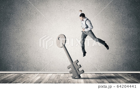Breaking through access concept with man in room crashing concre Breaking through access concept with man in room crashing concre 64204441