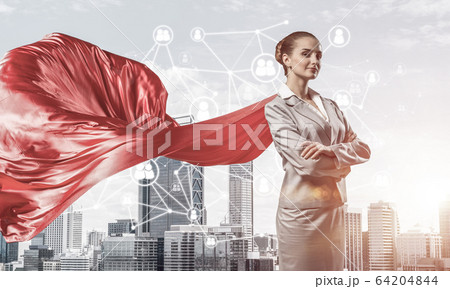 Concept of power and sucess with businesswoman superhero in big 64204844