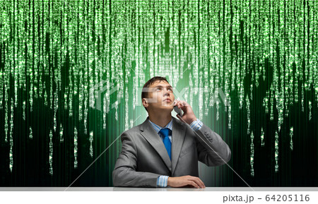 Young man talking on phone and looking upward. Young man talking on phone and looking upward. 64205116
