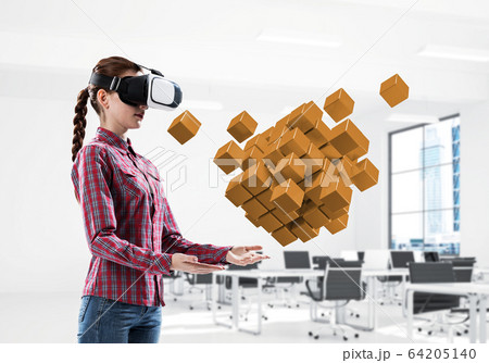 Girl in virtual reality mask experiencing virtual technology world. Mixed media Girl in virtual reality mask experiencing virtual technology world. Mixed media 64205140