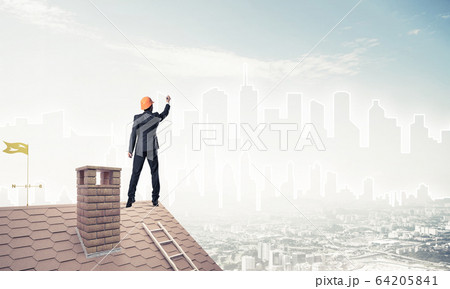 Man architect draw silhouette of modern city on blue sky. Mixed Man architect draw silhouette of modern city on blue sky. Mixed 64205841