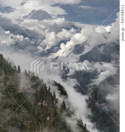Nilgiri peak and cloudy Himalayas Monsoon time in Nilgiri peak and cloudy Himalayas Monsoon time in 64208611