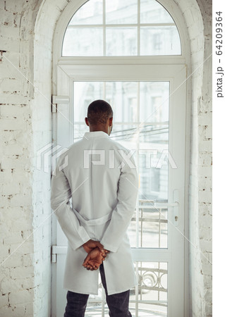 African-american doctor consulting, working in cabinet, close up African-american doctor consulting, working in cabinet, close up 64209364
