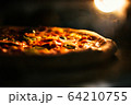 Pizza baked in an electric oven close-up 64210755