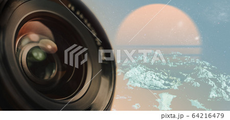 Beautiful camera lens with yellow light of glass Beautiful camera lens with yellow light of glass 64216479