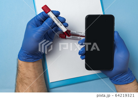 Doctor holding test tube with blood for 2019-nCoV 64219321