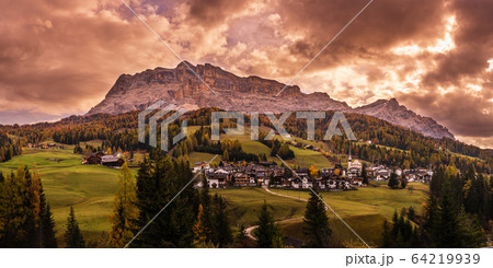 Sunny colorful autumn alpine Dolomites mountain scene, Sudtirol, Italy. Peaceful view from alpine path road. 64219939
