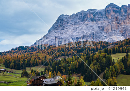 Sunny colorful autumn alpine Dolomites mountain scene, Sudtirol, Italy. Peaceful view from alpine path road. Sunny colorful autumn alpine Dolomites mountain scene, Sudtirol, Italy. Peaceful view from alpine path road. 64219941