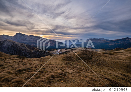 Evening twilight autumn alpine Dolomites mountain scene, Trento, Italy. Lake or Laghetto Baita Segantini view. Evening twilight autumn alpine Dolomites mountain scene, Trento, Italy. Lake or Laghetto Baita Segantini view. 64219943